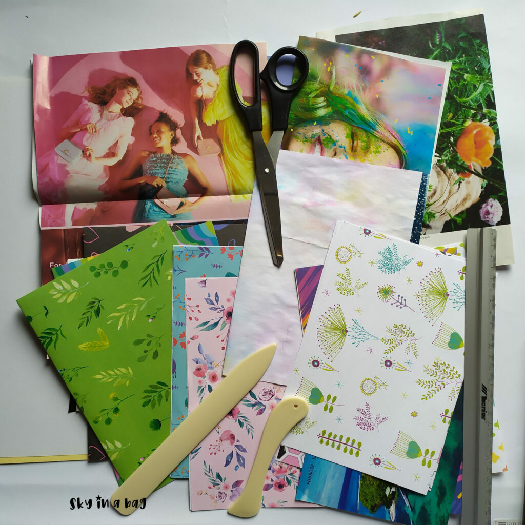 Papiery scrapbookingowe i wycinki z gazet wybrane do stworzenia junk journala.