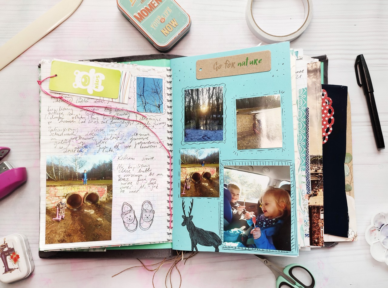 Example of memory documenting in a junk journal spread: drawings, photos, tags.